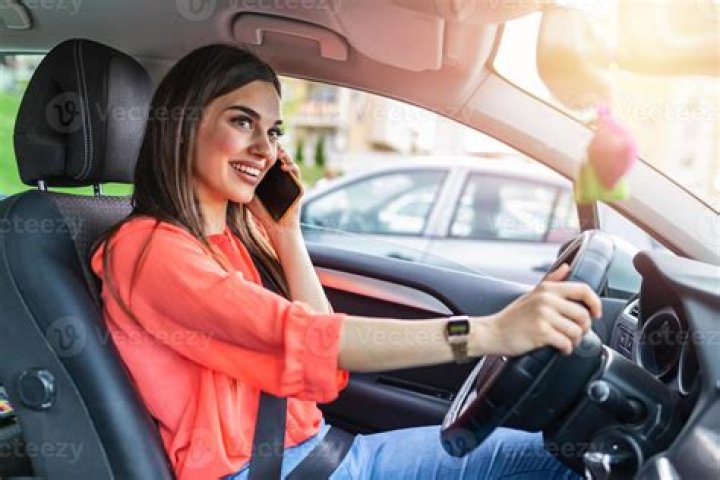 What happens if you get caught talking on the phone while driving?